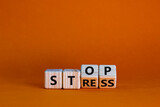 Stop stress and be health symbol. Turned wooden cubes and changed words 'stress' to 'stop'. Beautiful orange background. Psychological, business and stop stress concept. Copy space.