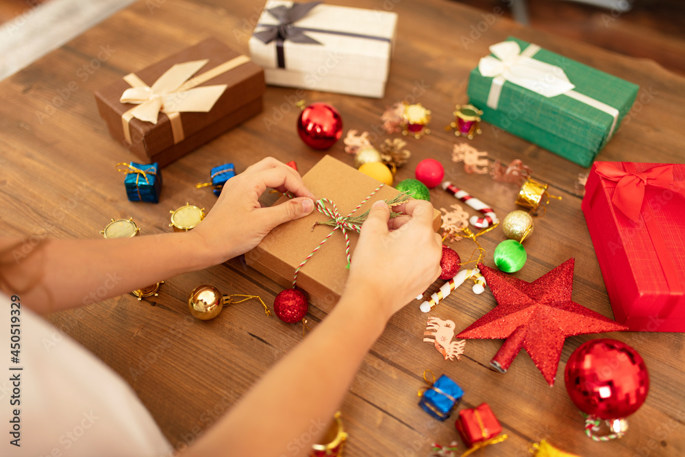 child preparing new year gift wrapping. christmas and party concepts.