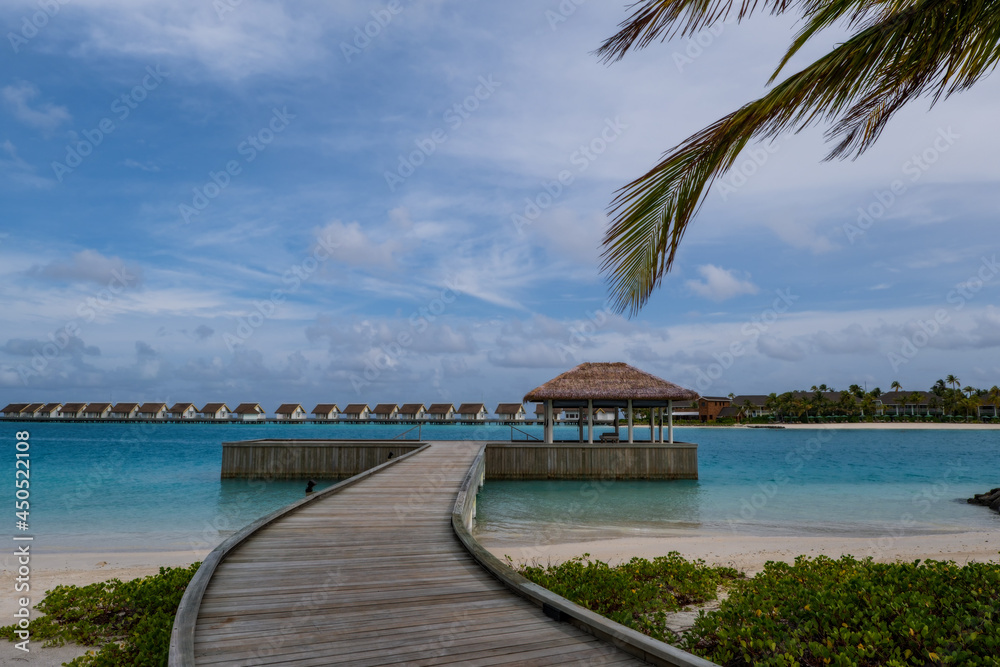 hard rock hotel pier end on a turquoise water. Crossroads Maldives, july 2021