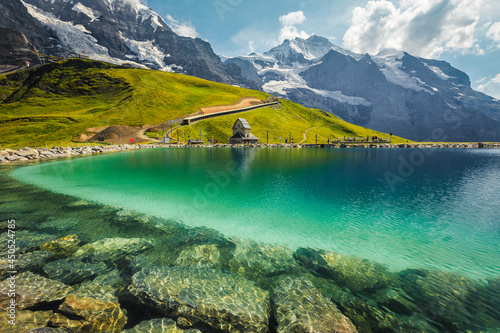 Fallbodensee lake and high mountains with glaciers, Bernese Oberland, Switzerland photo