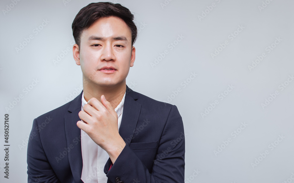 Portrait of Asian handsome business man wearing formal suit, cross his arms and smiling with confident with white background. Portrait of Asian handsome business man wearing formal suit, cross his arms and smiling with confident with white background.