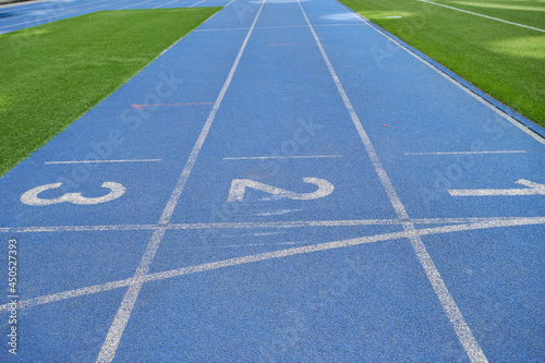 Athletic blue stadium tracks.