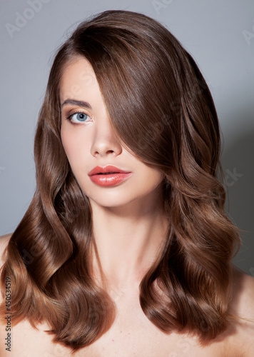 Beautiful portrait of woman with healthy and shiny hair, glamour beauty 