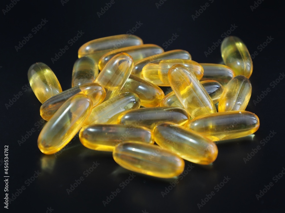Omega-3 cod liver oil in a white container and with a white background picture. Omega-3 cod liver oil in a white container and with a white background picture.