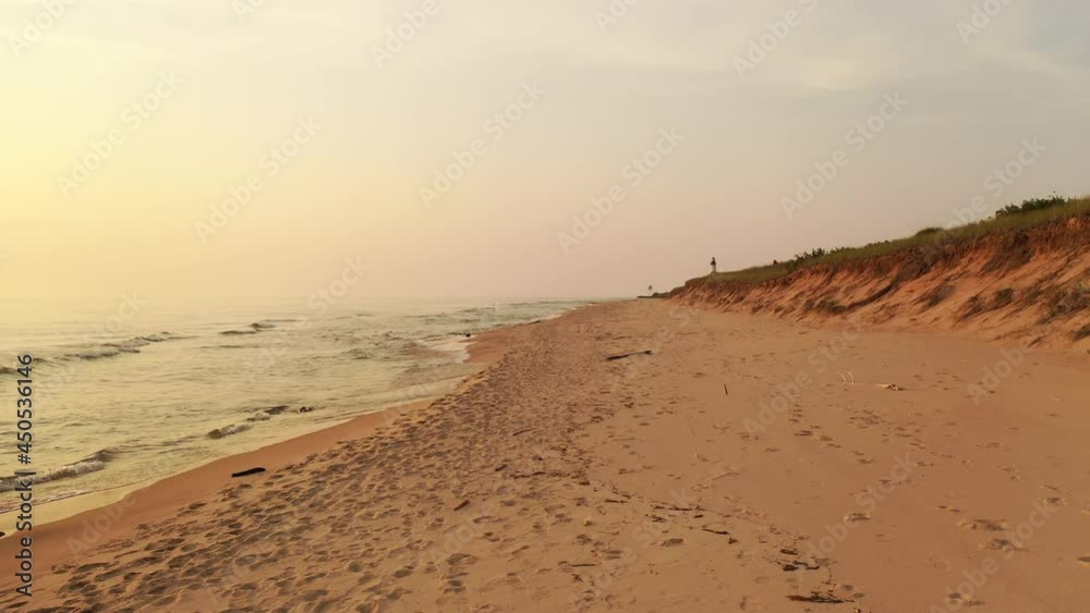 Sand beach, dunes, lighthouse aerial view coastline at sunset. Scenic landscape, seascape Sand beach, dunes, lighthouse aerial view coastline at sunset. Scenic landscape, seascape