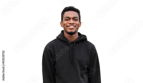 Portrait of modern smiling young african man looking at camera wearing a black hoodie isolated on white background