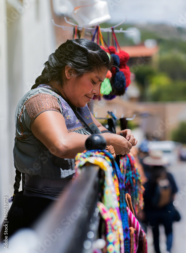 Portrait of handmade clothing saleswoman, specialized in embroidery clothing