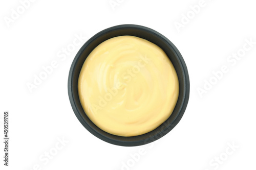 Bowl with cheese sauce isolated on white background