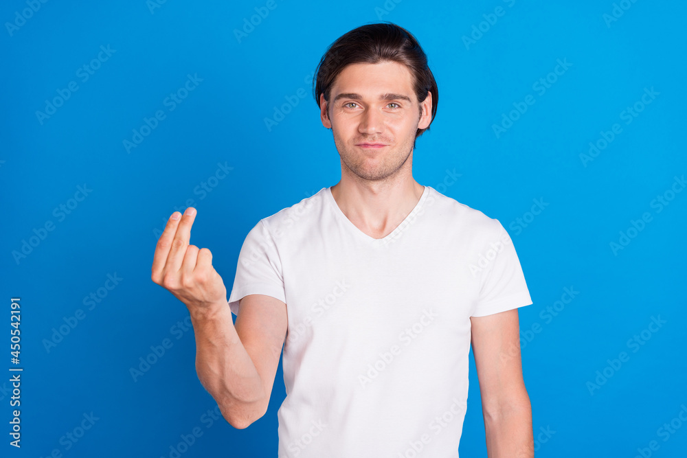 Fototapeta premium Photo of young positive charming man make fingers money sign ask demand isolated on blue color background