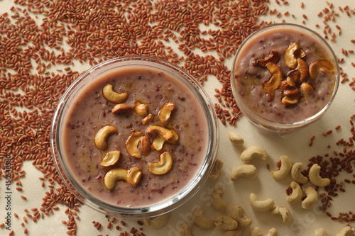 Red rice porridge with navra rice, milk and ghee. A healthy breakfast option. photo