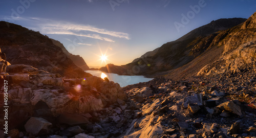 Panoramic View of Vibrant Colorful Glacier Lake up in Rocky Mountains in Canadian Nature Landscape. Sunny Summer Sunset. Wedgemount Lake Hike in Whistler, British Columbia, Canada. Background Panorama © edb3_16
