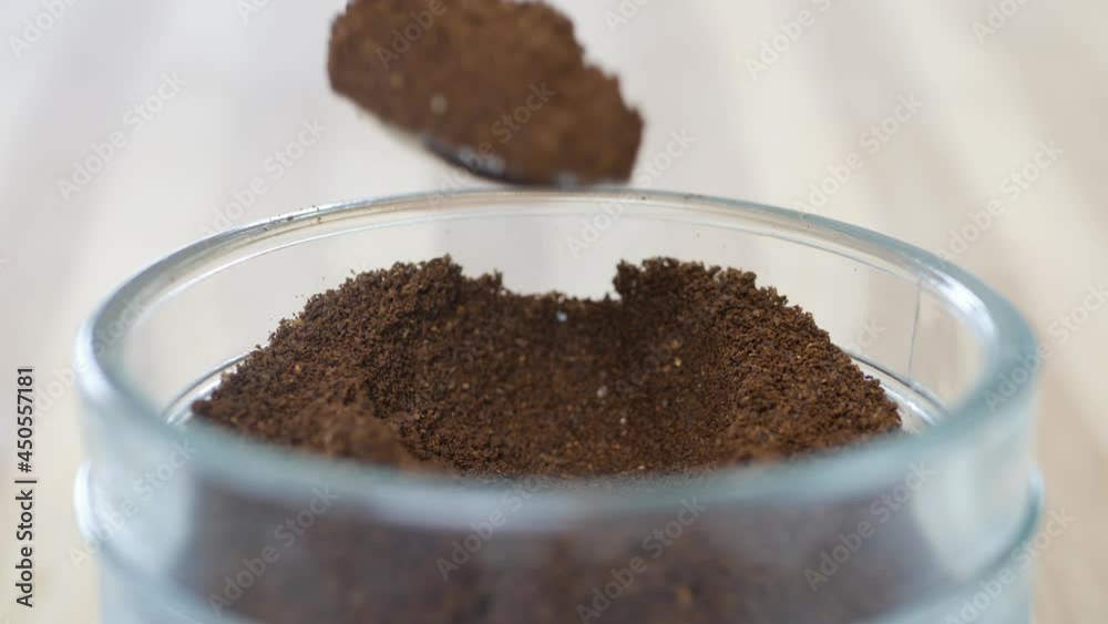 Shooting with a Person Taking a Teaspoon of Freshly Ground Coffee from a Jar. Preparing a Fresh Coffee in the Morning. Shooting with a Person Taking a Teaspoon of Freshly Ground Coffee from a Jar. Preparing a Fresh Coffee in the Morning.