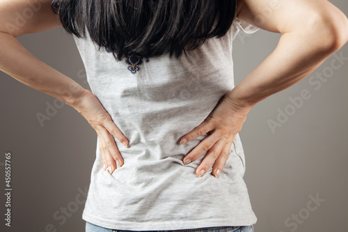 the woman has kidney pain photo