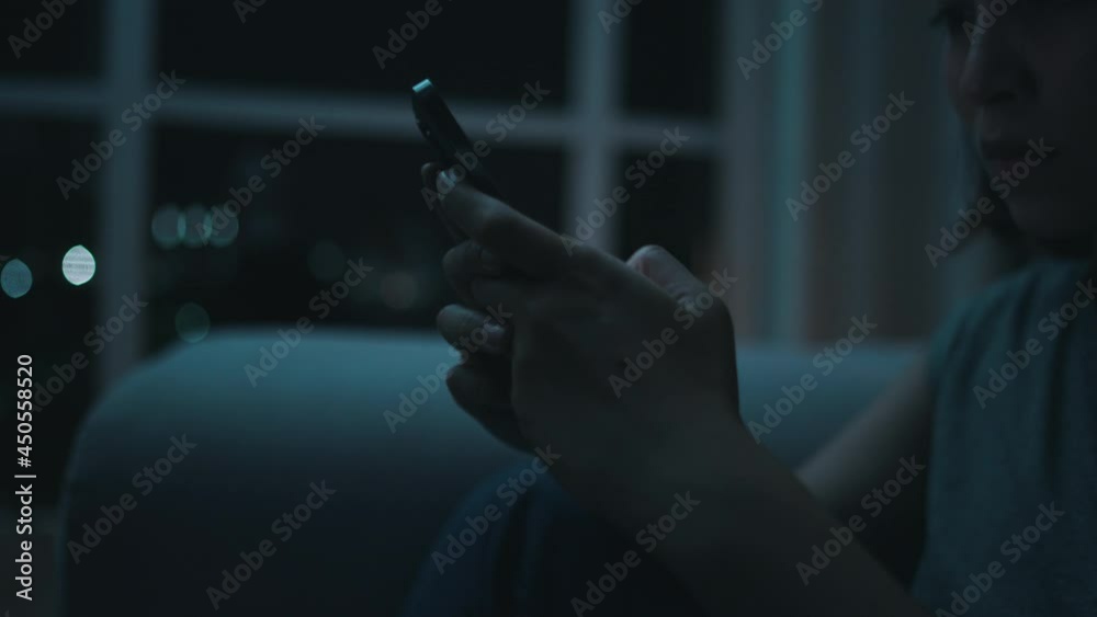 girl typing a message in the evening apartment