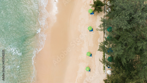 Top view.Panorama beautiful beach with white sand on sunny day. palm trees umbrellas sunset summer holiday. 