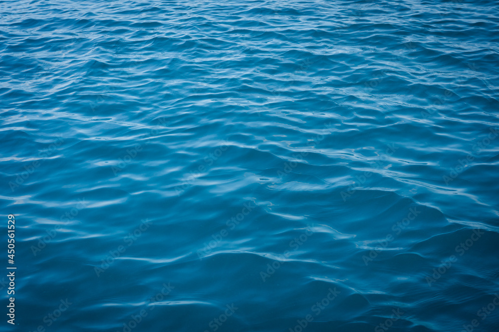 Blue sea water.Calm Sea Ocean And Blue Sky Natural Backgrounds.sea and sky on the summer day. Sea water clear sky and clouds.pacific ocean.