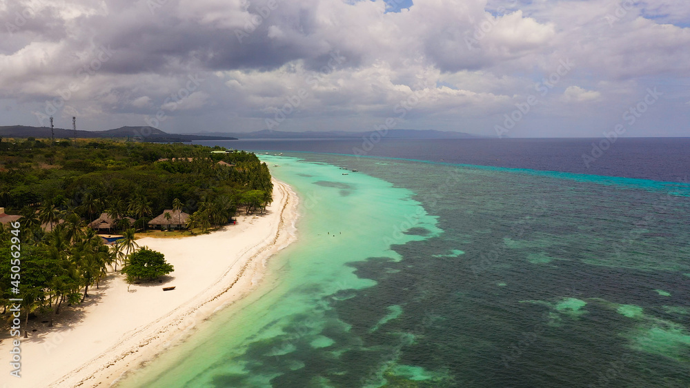 Aerial drone of coast, turquoise sea and sand beach. Panglao island, Bohol, Philippines.