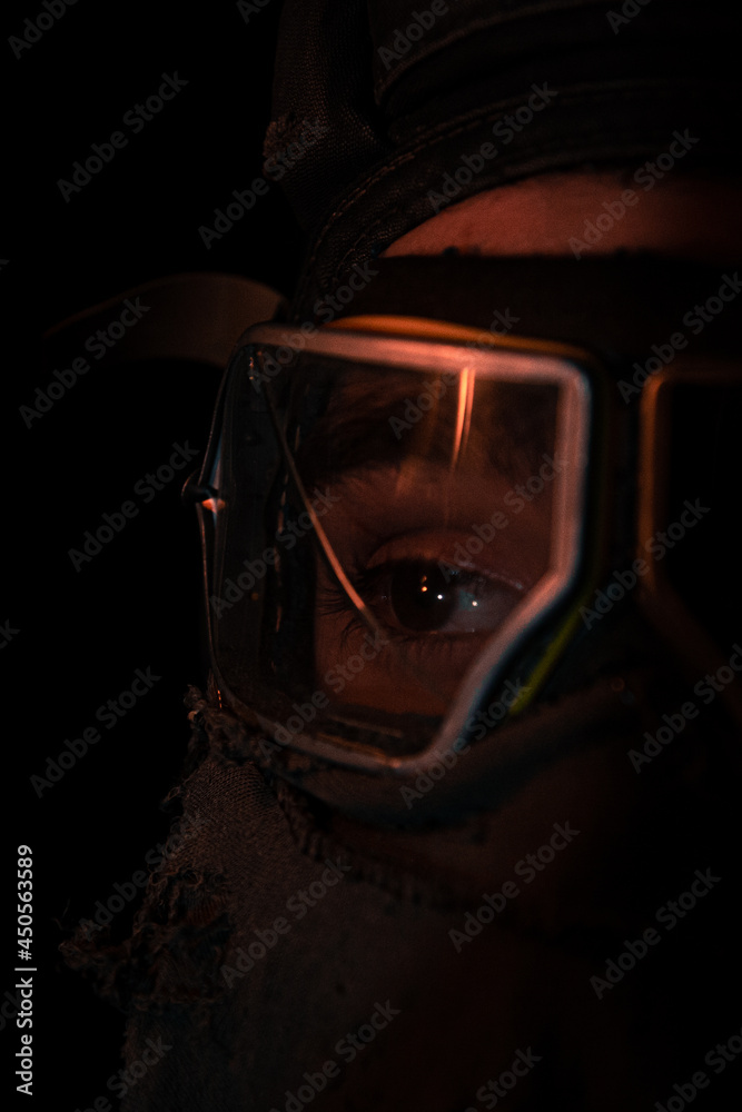Fototapeta premium Fire reflection in a gas mask macro 