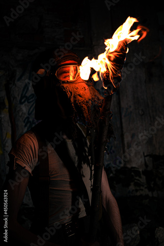 Fire reflection in a gas mask macro