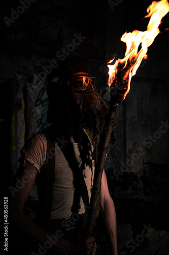 Fire reflection in a gas mask macro