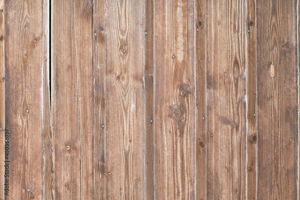 Naklejka premium Light brown wooden background with old vertical planks