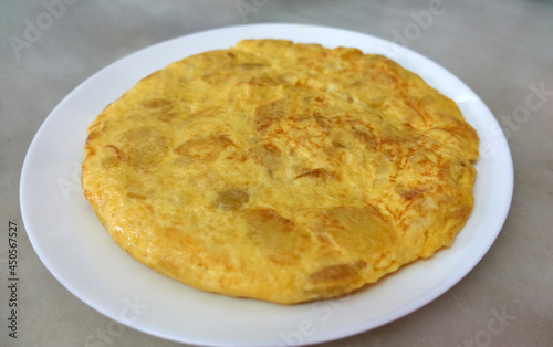 Spanish potato omelette plated on a white plate