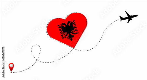 Airplane flight route with Republic of Albania flag inside the heart. Travel to your favorite country.