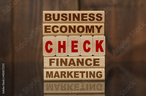 Wallpaper Mural Wooden blocks with the text - Business, Economy, Finance, Marketing and CHECK Torontodigital.ca