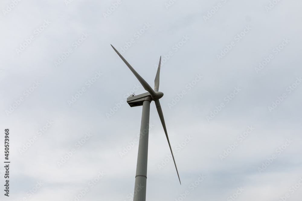 Wind turbine propeller. A wind generator, wind farm or wind turbine is a device for converting the kinetic energy of the wind flow into electrical energy. Wind turbine propeller. A wind generator, wind farm or wind turbine is a device for converting the kinetic energy of the wind flow into electrical energy.
