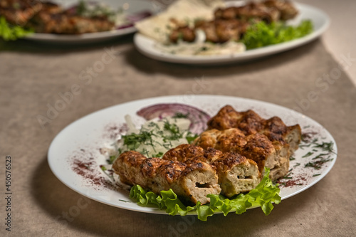 Chicken lula kebab with herbs and onions