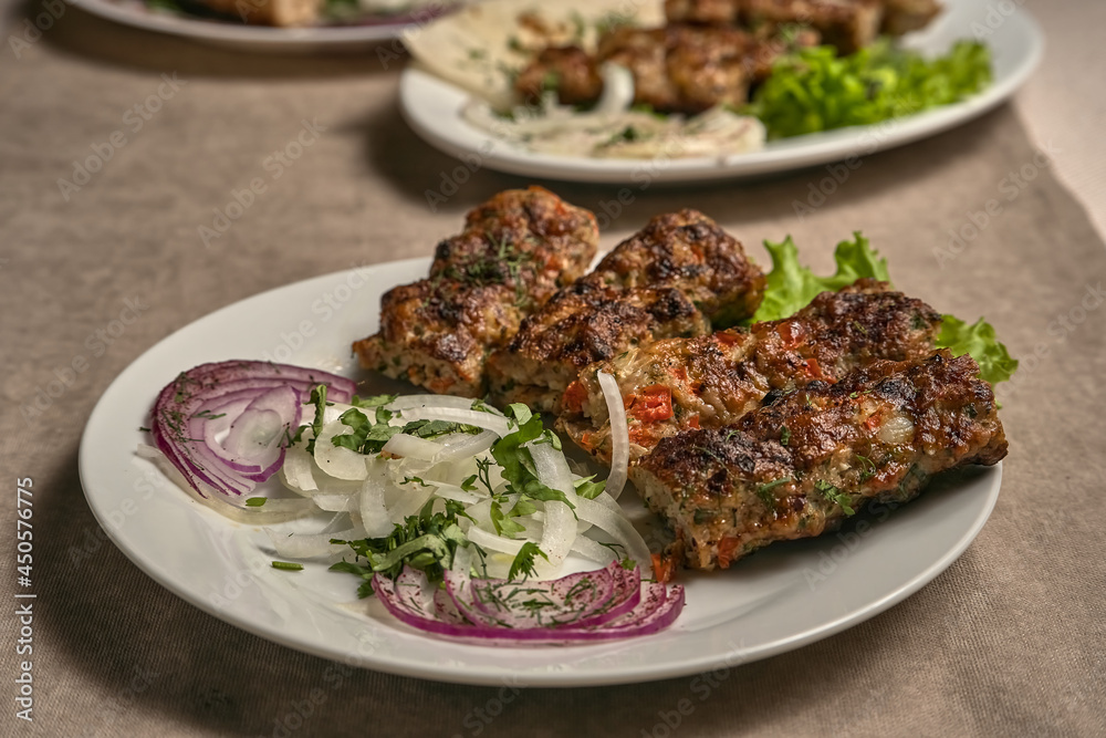 Beef lula kebab with herbs and onions