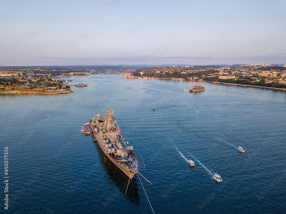 Russian military ship in Sevastopol bay at Navy day, aerial view