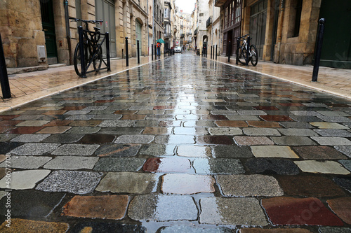 wet narrow street in old town Bordeaux (France) after the rain