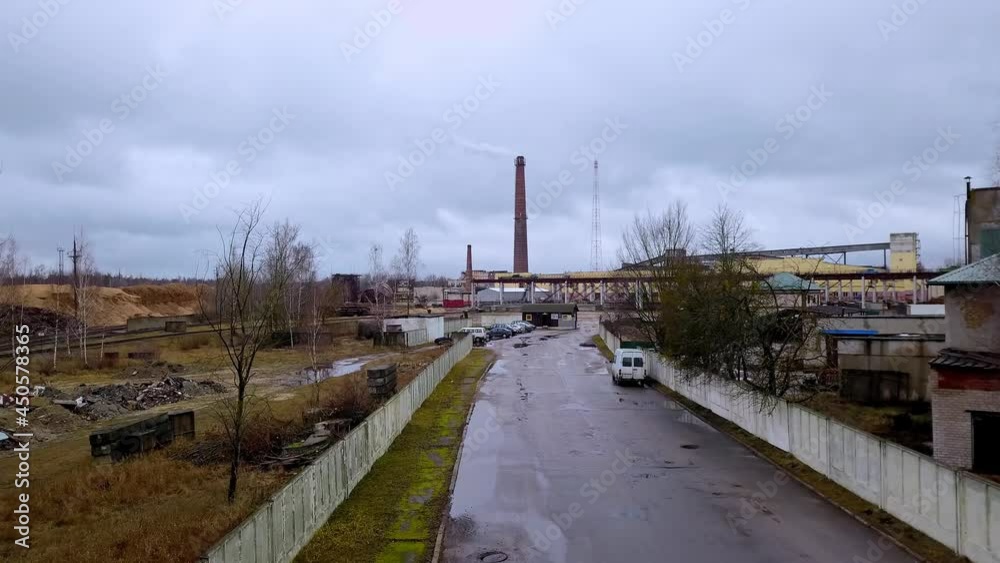 Aerial view of Industrial zone and thermal power plant. Industrial zone in the city. Tower and brick building. Ecological problem concept. Aerial view of Industrial zone and thermal power plant. Industrial zone in the city. Tower and brick building. Ecological problem concept.