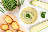 Green bean and zucchini soup with croutons