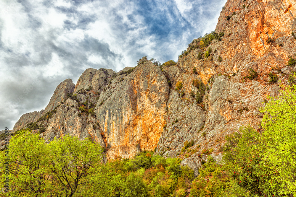 dramatic autumn landscape of cliffs with steep walls