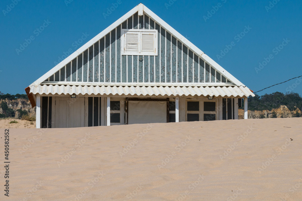 characteristic wooden house along the beach side at Costa da Caparica in Lisbon, Portugal.