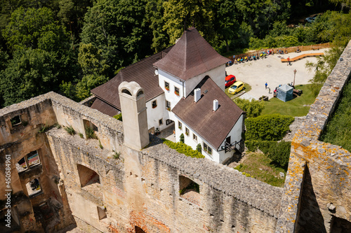 Landstejn, South Bohemian, Czech Republic, 03 July 2021: medieval knights ancient ruins of Romanesque and gothic castle at sunny summer day, Stone wall standing on green hill, Forest scenic landscape photo