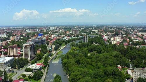 Aerial view of Vladikavkaz city, central park, Terek river and Bank bridge. photo