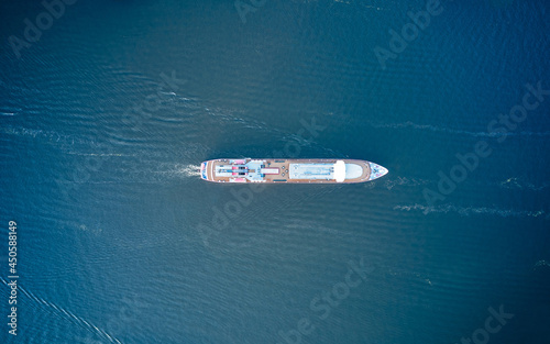 Top down view of the ship is floating on water aerial view from above © mediaeugene