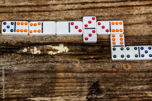 Peças de dominó sobre uma tabua envelhecida. photo