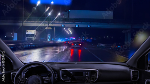 View from the car to the traffic on the night highway