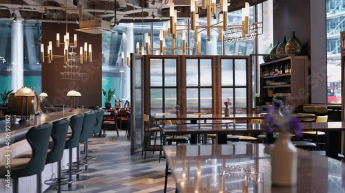 Panning shot of bar and restaurant tables