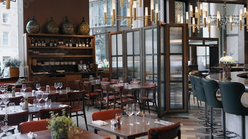 Panning shot of restaurant interior and bar photo