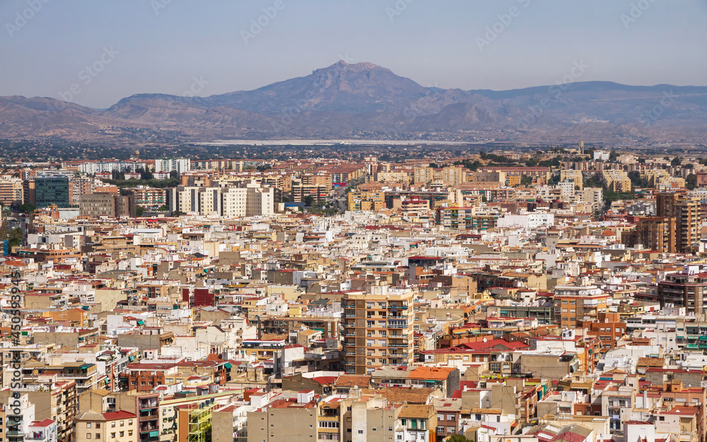 View from the top of the Castle of a sector of the inner city of Alicante and mountains that surround it  
