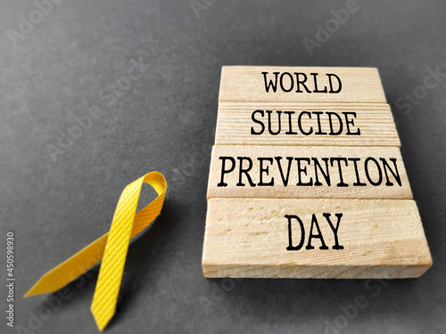 Celebration Day Concept - World suicide prevention day words on wooden blocks background. Stock photo.