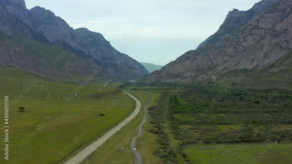Aerial view. Mountain road between two mountain ranges.