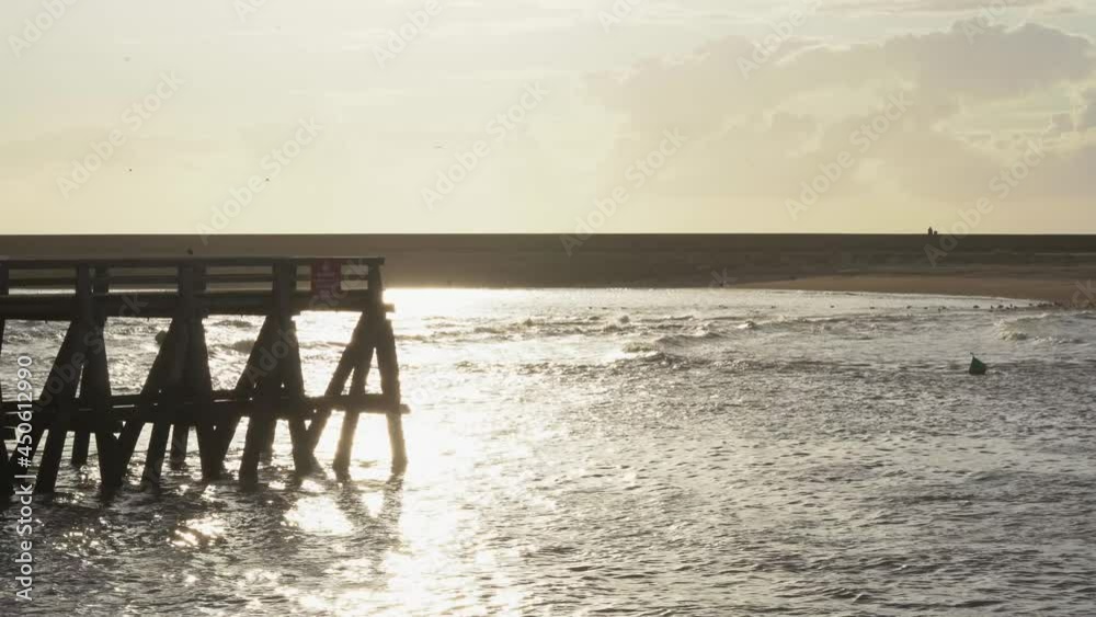 France, Normandy, the mouth of the River Touques , the sea and the wooden pier in Deauville France, Normandy, the mouth of the River Touques , the sea and the wooden pier in Deauville