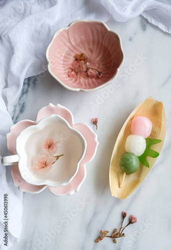 Homemade and shop bought snacks and desserts. Sakura Cha with Dango   Caramelised Banana Bread. Japanese mochi with dried sakura flower hot tea.