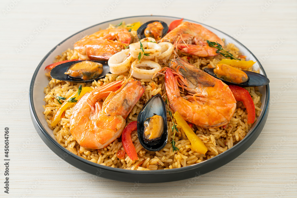 Seafood Paella with prawns, clams, mussels on saffron rice Seafood Paella with prawns, clams, mussels on saffron rice